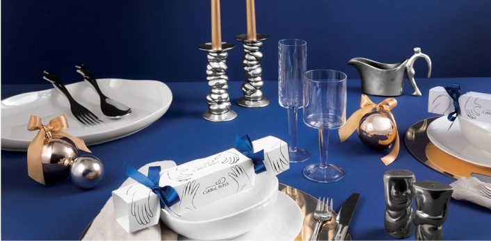 Carrol Boyes setting on a luxurious blue table cloth